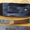 Folding knife with locking clip-point blade, and leather sheath [Used] - Image 6
