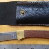 Folding knife with locking clip-point blade, and leather sheath [Used]