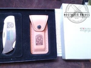 Vintage Zippo - Made by Case. Pennsylvania Fish & Boat commission 1998 - #374, Lock-back knife with orig. leather sheath and packaging[Unused - Pristine Mint Cond.]